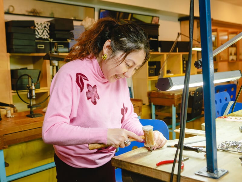 Woman making a silver ring